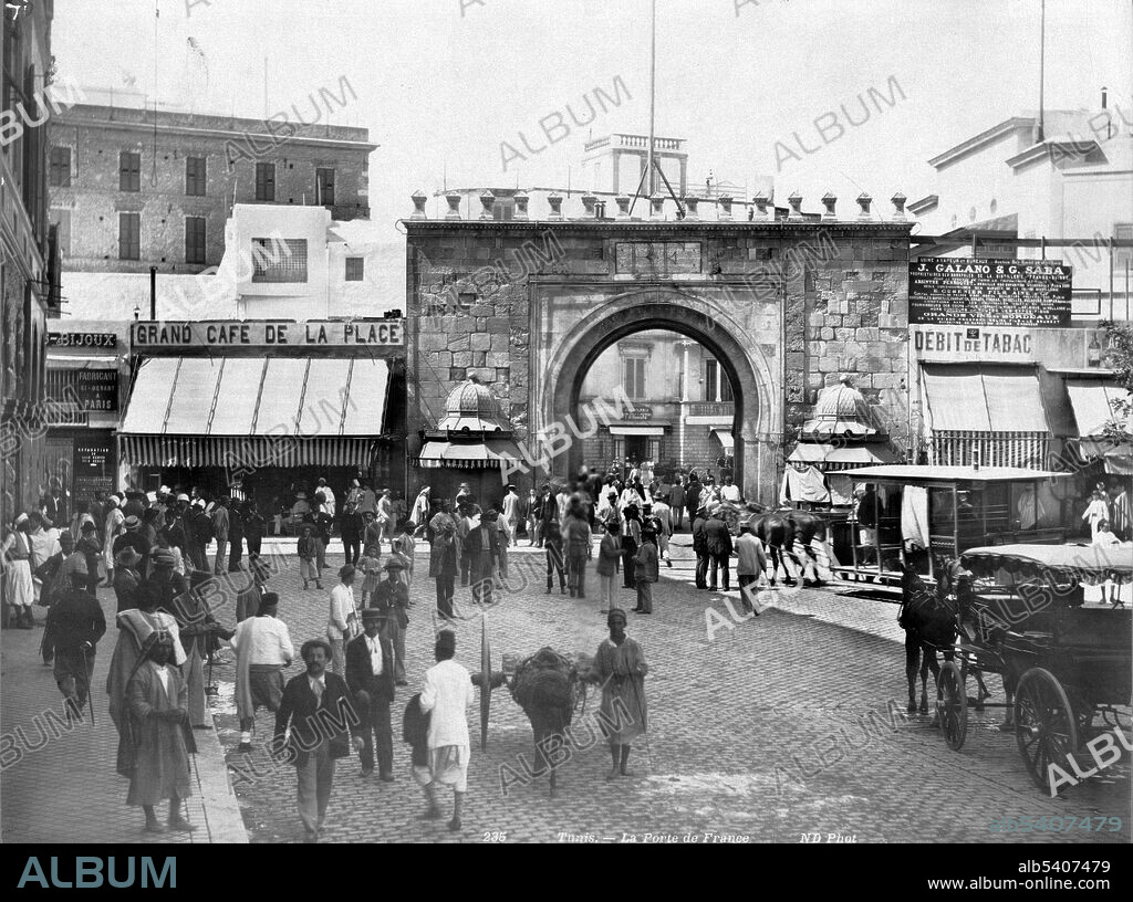 Bab el Bhar, also known as Porte De France, is a city gate in Tunis, the capital of Tunisia. It marks the separation between the Medina of Tunis and the European city. The gate is made up of a lowered archway and topped by a crenellated parapet. Tunis is the capital and the largest city of Tunisia. In ancient times, Tunisia was primarily inhabited by Berbers. Phoenician immigration began in the 12th century BC; these immigrants founded Carthage. A major mercantile power and a military rival of the Roman Republic, Carthage was defeated by the Romans in 146 BC. The Romans, who would occupy Tunisia for most of the next 800 years, introduced Christianity and left architectural legacies like the El Djem amphitheater. The Muslims conquered the whole of Tunisia by 697, followed by the Ottoman Empire between 1534 and 1574. The Ottomans held sway for over 300 years. The French colonization of Tunisia occurred in 1881. Tunisia gained independence with Habib Bourguiba and declared the Tunisian Republic in 1957. Neurdein frer`es, between 1860 and 1900.