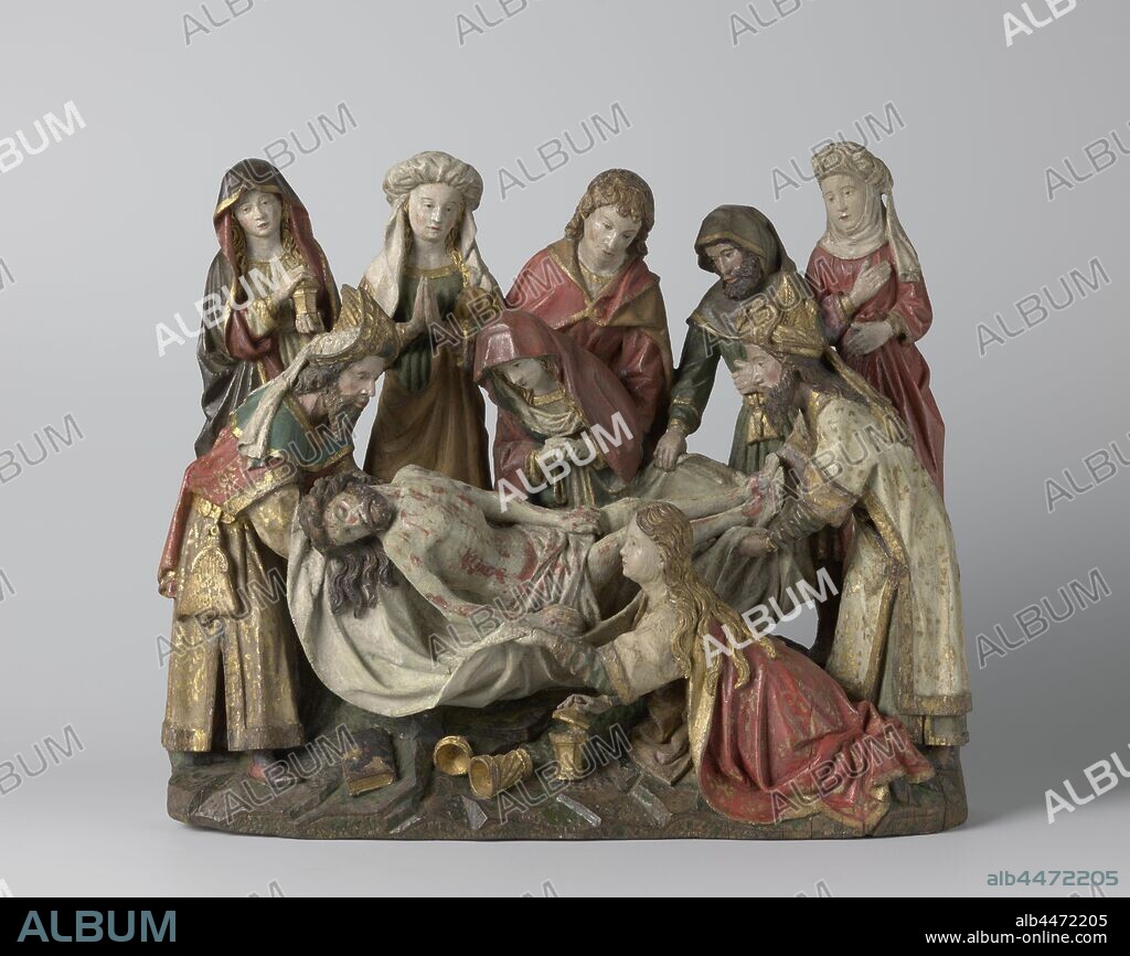 The Entombment, Nicodemus and Jozef van Arimathea stand opposite each other on a rocky, elongated plot, carrying the rigid body of Christ between them on a limp cloth. In the foreground Mary-Magdalene kneels, profile a little to the left and a little forward, holding the linen cloth with her left hand, while with the right she lifts the lid of the ointment canister, which stands on the floor in front of her. Behind Christ, Mary kneels over him with folded hands and looks down at her son's turned face. She is supported by the poor by St. Jan, who is behind her. To their left two women, one with hands folded with devotion, the other with a pot of spices, both look somewhat absent. To the right of St. Jan is Simon van Cyrene (?), Who also holds the linen cloth with his right hand and holds the left one above the belt with the purse hanging on it. Diagonally behind him is a woman who is holding her right hand in front of her chest while she lifts her skirt slightly with the other. On the bottom are a book and, fallen over, a second ointment canister with the lid next to it. Nicodemus and Joseph of Arimathea are almost similar in gesture and clothing, each wearing a richly decorated Jewish hat with stored front flap and a sash hanging backwards, furthermore, one or two dalmatian-style costumes over a long-sleeved robe, the left figure still has a shoulder cloak and clip bag on a belt. His arms protrude through the side slits of the long sleeves of the upper rug, which are laid in a loose loop on the back, the sleeves on the right-hand side are folded. Magdalena's cloak, over which her wavy hair lies, slides from the back and partially covers her footwear. Mary wears the cloak over her head and a veil that falls before her ., St. John's open cloak, closed with a knot in front of the chest, releases part of his tunic. The woman on his left is wearing a turban over her headscarf and holding a wad of her cloak with her right forearm, the figure to the left of her has a cloak.
