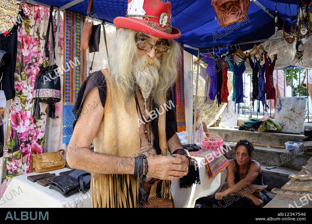 old hippie craftsman, Hippie market, Sant Joan de Labritja, Els Amunts, Ibiza, Balearic Islands, Spain.
