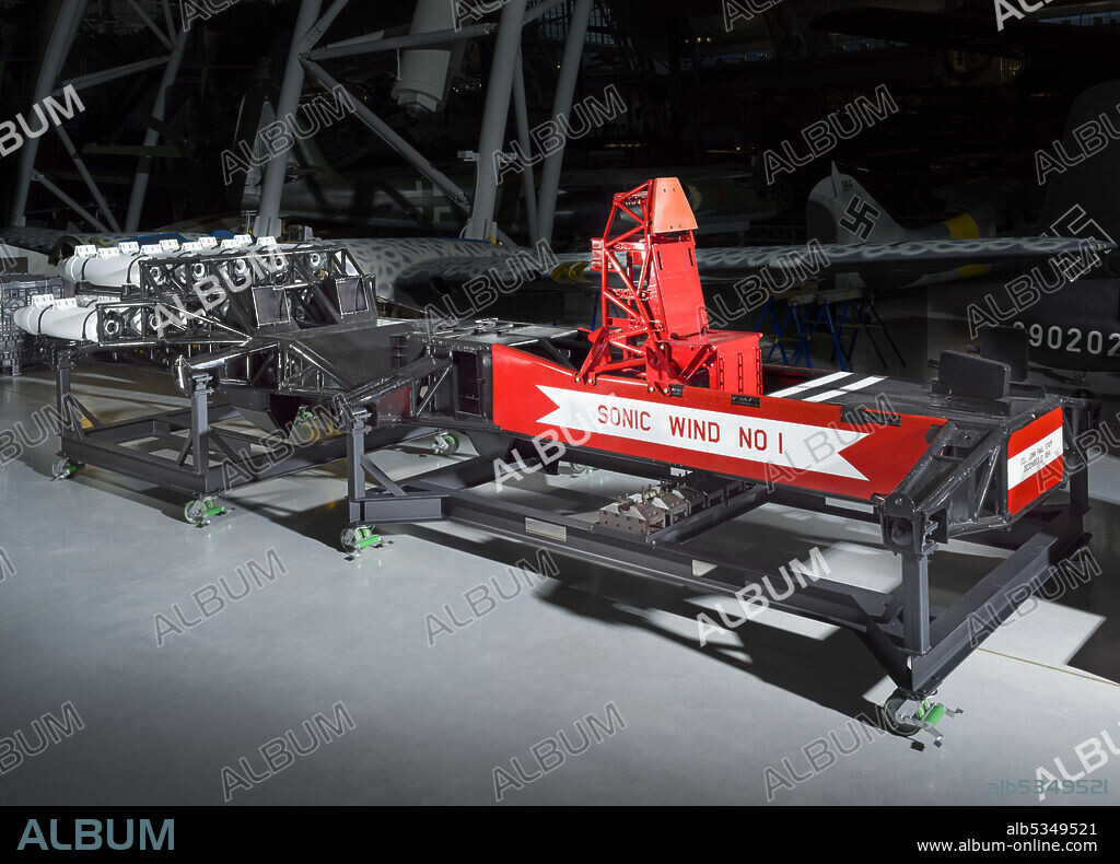 NORTHROP CORPORATION. This is the Sonic Wind 1 rocket sled, which was powered by nine solid fuel rockets with 40,000 pounds total thrust for five seconds. Air Force Lt. Col. John Stapp first rode the sled on March 19, 1954, at Holloman Air Force Base, New Mexico, and reached a speed of 613 feet per second. During acceleration, he was subjected to a force of 22 times that of gravity (22 g's). He made his second run on the sled on August 20, 1954 attaining a speed of 735 feet per second. On December 10, 1954, he made his last and most notable ride on the sled reaching a speed of 632 miles per hour. Stapp underwent a force of 40 g's, the highest g force any human had endured to that time. The sled rides helped determine the effects of extreme acceleration on the human body, data that was very useful in aerospace medicine. The sled was transferred to the Smithsonian in 1966 by the U.S. Air Force.
