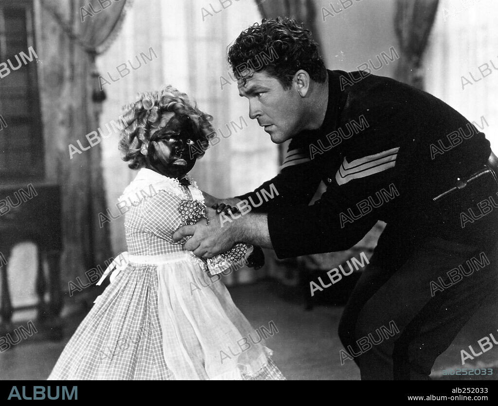 BIG BOY WILLIAMS and SHIRLEY TEMPLE in THE LITTLEST REBEL, 1935, directed by DAVID BUTLER. Copyright 20TH CENTURY FOX.