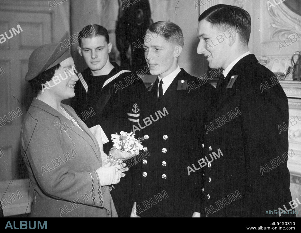 The Queen Meets South African Sailors - Her Majesty talking to leading Seaman Allen Powell, from Port Elizabeth, Midshipman, Edward Jupp, R.N.R. from Cape Town, and Midshipman Bryan Powell. RN.R. from Cape Town, who attended the depot for kit replacement. The Powells are not related.H.M. The Queen visited the Officers kit Replacement Organisation in South Audley Street (London). February 10, 1943. (Photo by London News Agency Photos Ltd.).