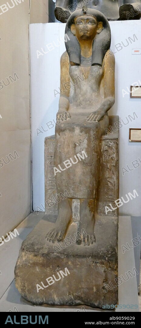 Painted sandstone statue of Queen Mut-Nofret, mother of King Tutmosis II.