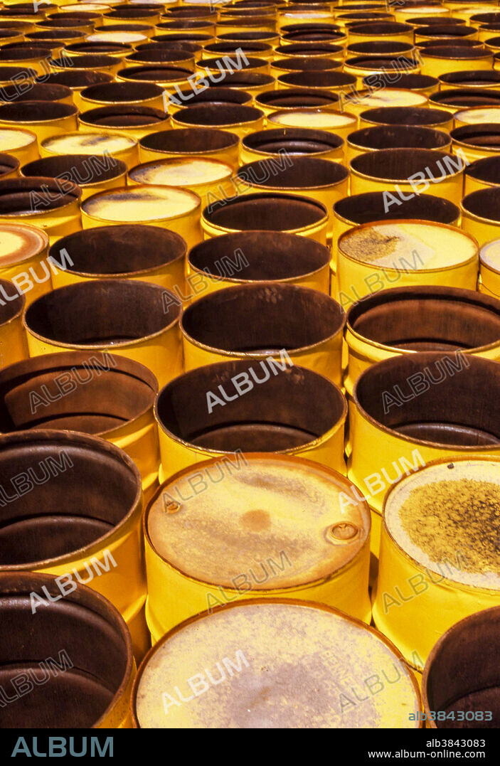 55-gallon yellow oil drums form a pattern on an industrial site in Houston, Texas.