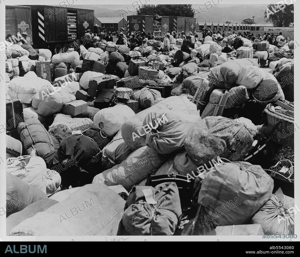 DOROTHEA LANGE. Japanese relocation, California. Baggage belonging to evacuees of Japanese ancestry at an assembly center in Salinas, California, prior to a War Relocation Authority center.