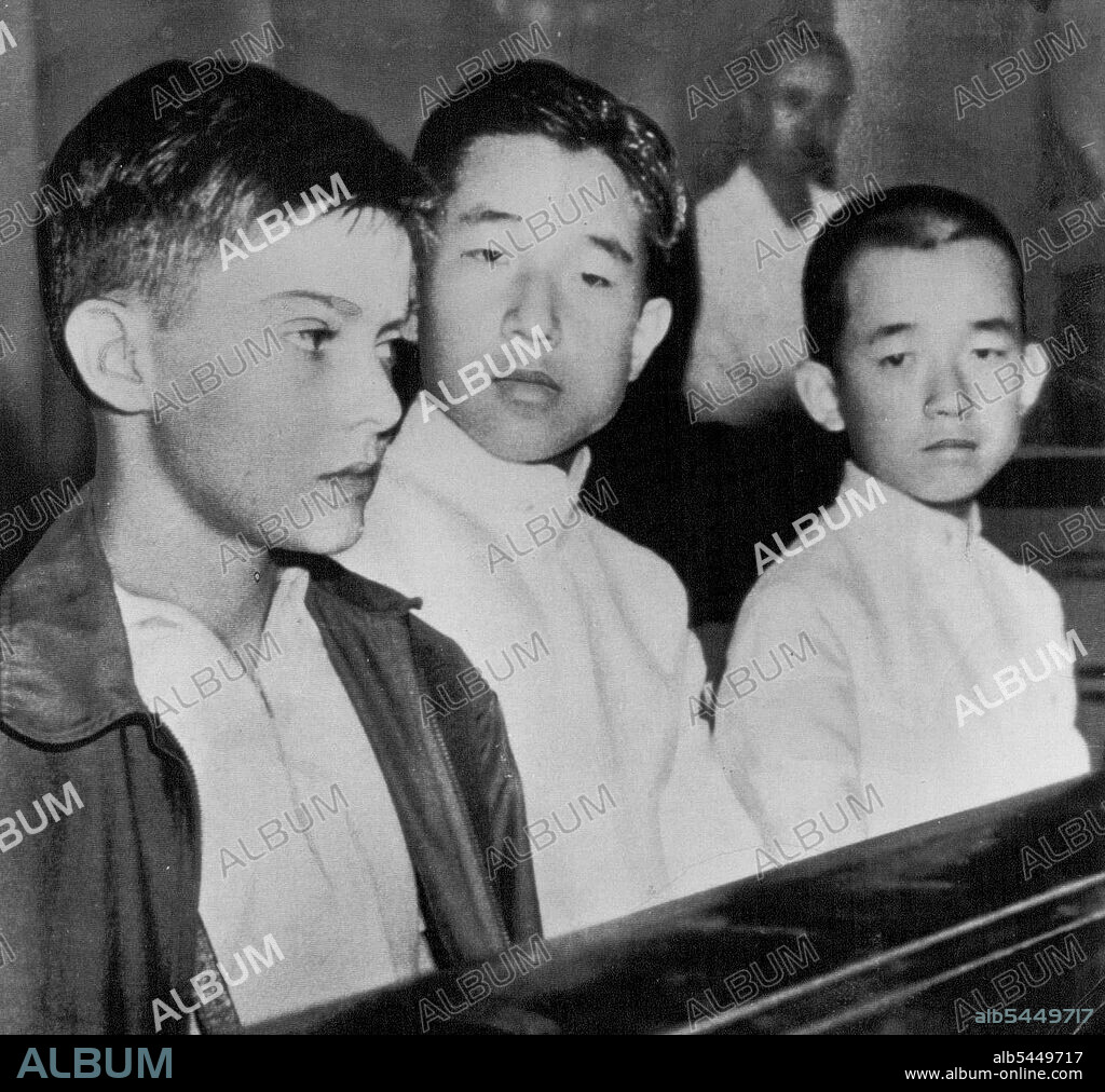 MacArthur's Son Meets Japanese Princes -- Arthur MacArthur (left), 11-year-old son ***** General Douglas MacArthur, sits with the eldest and youngest sons of Emperor Hirohito at an inter-collegiate swimming meet in Tokyo, September 15. In center is Crown Prince Akihito, 15. At right is Prince Masahito, 13. It was the first time that the son of the U.S. supreme commander in Japan had met the sons of the emperor. September 19, 1949. (Photo by AP Wirephoto).
