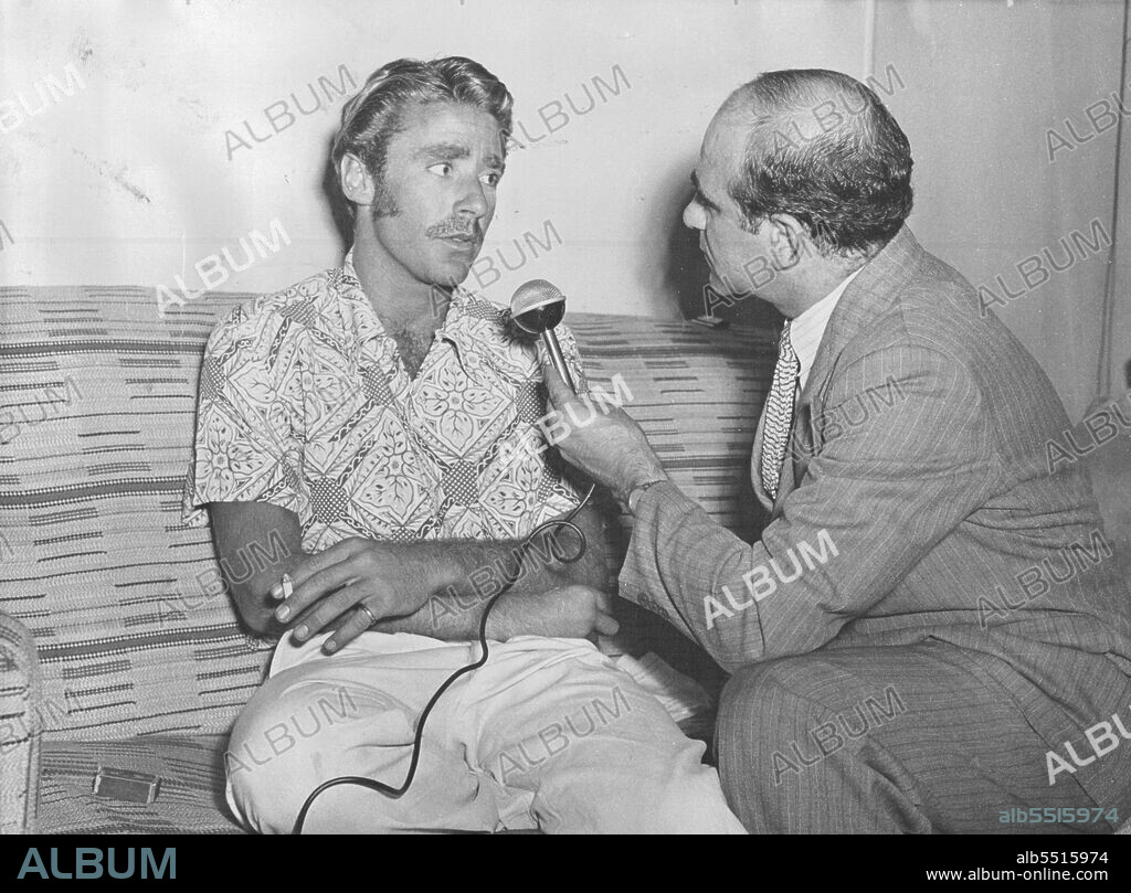 Hollywood screen star Peter Lawford being interviewed in his suite at the Hotel Australia by 2SM's News Editor Tom Jacobs.The star is in Australia to play a leading role with Maureen O'Hara & Richard Boone in the 20th Century Fox Production, "Kangaroo". November 19, 1950.