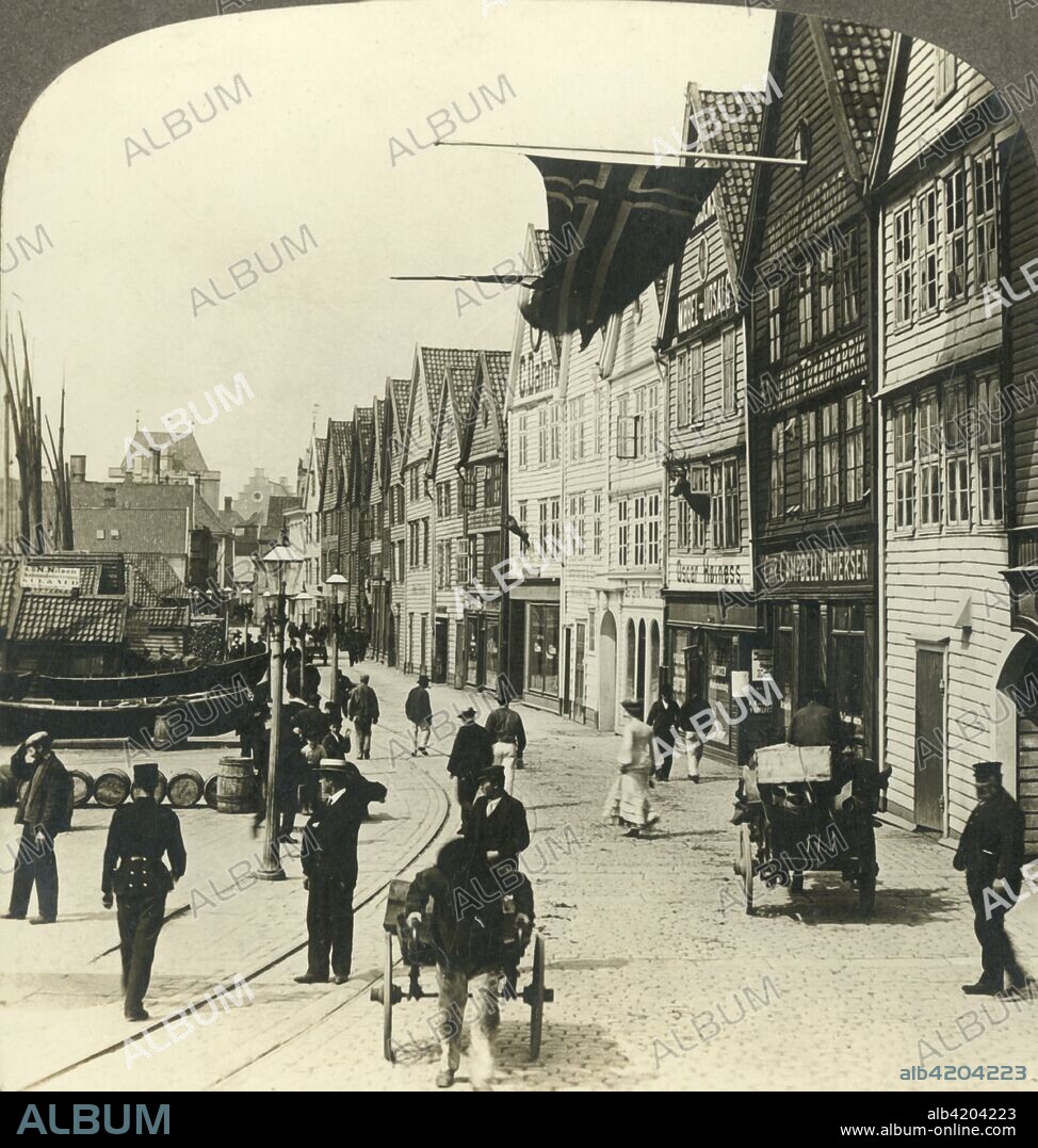 'Warehouses along the quay in the old town of Bergen, for centuries the great fish mart of Norway', c1905. From "The Underwood Travel Library - Norway". [Underwood & Underwood, London ].