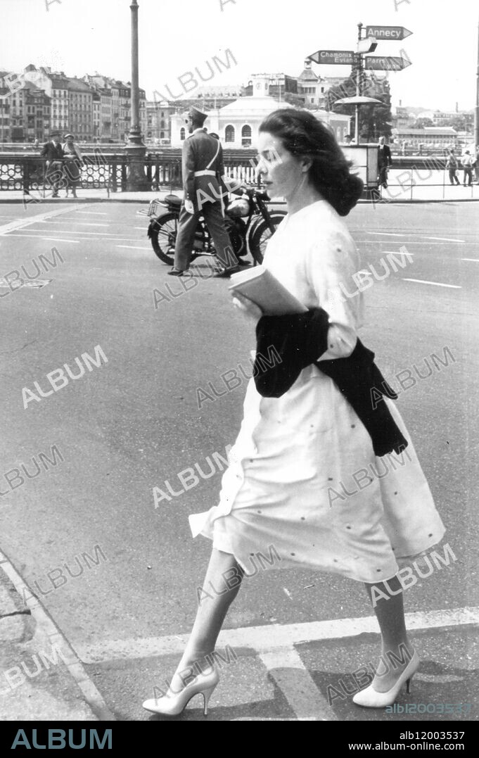 Simone Micheline Bodin Graziani ( 1925 ) known professionally as Bettina , was a leading French fashion model of the 1950s and an early muse to the fashion designer Hubert de Givenchy . She also has been a designer of knitwear and , later , a poet and composer . Photo shows : Bettina seems to be in a hurry as she steps smartly across the road in the rue de Mt Blanc in Geneva , Switzerland.