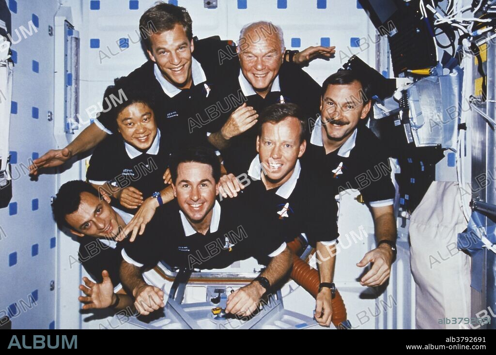 Portrait of the crew of the Space Shuttle Discovery during mission STS-95, (10/29/98-11/07/98). At center left is Chiaki Naito-Mukai, payload specialist representing Japan's space agency, (NASDA). Clockwise from Naito-Muka are: Scott Parazynski, (mission specialist); John Glenn, (payload specialist); Curtis Brown, (commander), Steven Lindsey, (pilot), Stephen Robinson, (mission specialist), and Pedro Duque, a mission specialist representing the European Space Agency, (ESA). During the mission, the crew conducted various experiments, as well as launching and retrieving the Spartan Satellite.