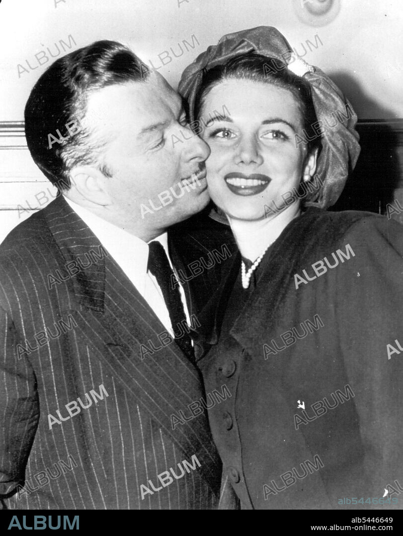 Happy Twosome -- Bandleader Xavier Cugat kisses actress Lorraine Allen of Hollywood, just after they obtained a marriage license today at City Hall. Cugat said they planned to wed later today. The Orchestra leader gave his age as 46 and Miss Allen listed her age as 26. October 15, 1947.(Photo by AP Wirephoto).