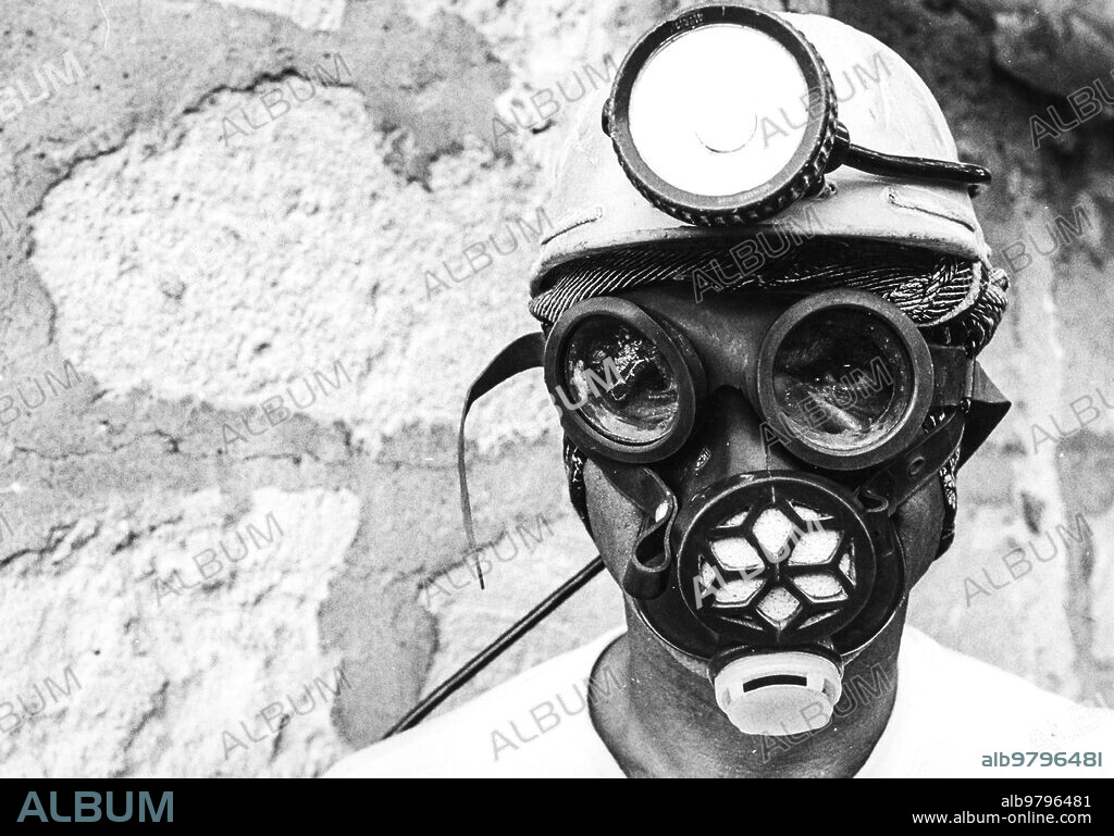 Miner of solfara vodi wearing a gas mask, assoro, sicily, 70s.