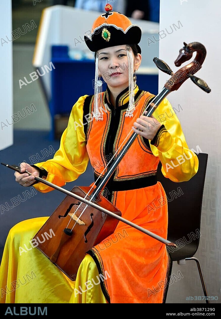Mongolian musician is playing the horse-head fiddle or Morin Khuur, also Morin Chuur, Mongolia
