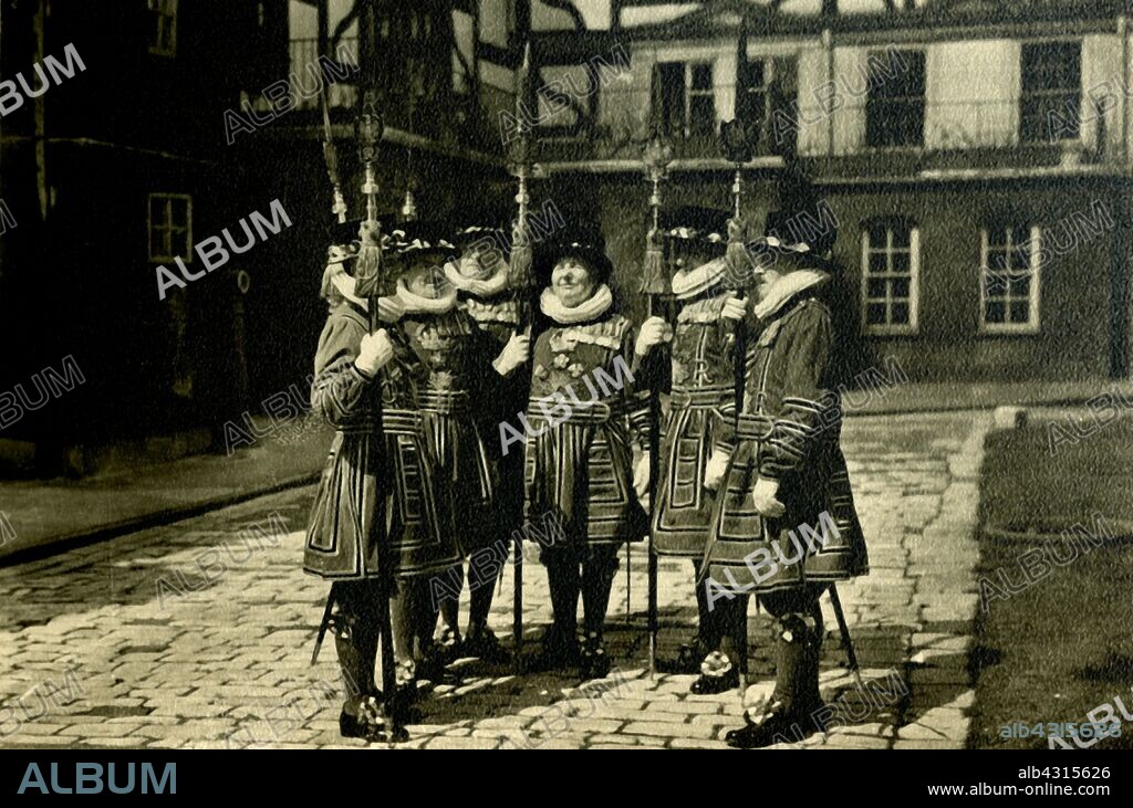 'Tower of London Yeoman Warders', c1920. The famous London 'Beefeaters' in their Tudor uniform. The ceremonial guardians of the Tower of London, officially known as Yeomen Warders of His (or Her) Majesty's Royal Palace and Fortress the Tower of London, and Members of the Sovereign's Body Guard of the Yeoman Guard Extraordinary, popularly known as Beefeaters, are responsible for looking after prisoners in the Tower, and for safeguarding the British crown jewels. Postcard.