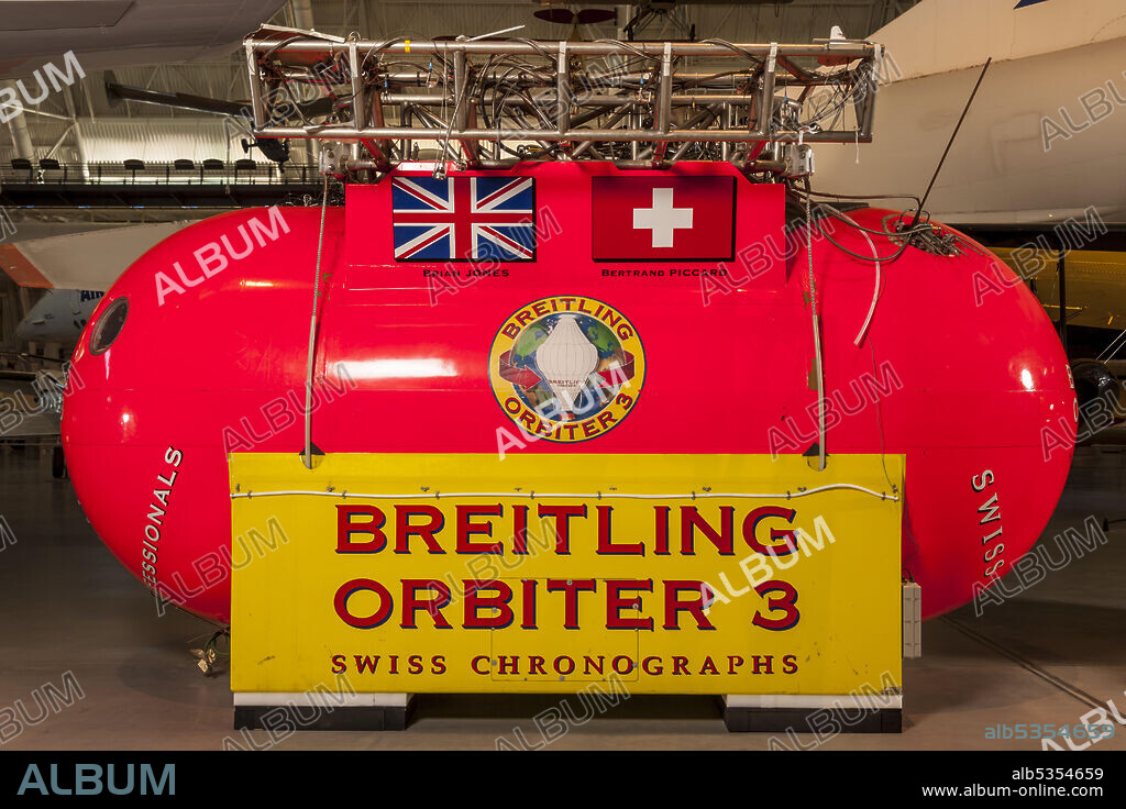 CAMERON BALLOONS. Basic structure is yellow and orange with the inscription, Breitling Orbiter 3. Upper structure houses burners and equipment. On March 21, 1999, Bertrand Piccard and Bryan Jones guided Breitling Orbiter 3, the first balloon to fly around the world non-stop, to a safe landing on a desolate stretch of desert in Western Egypt. It was a happy ending to a story that had begun in June 1980, when English pilot and balloon builder Don Cameron announced that a group of adventurers planned to circumnavigate the globe in a balloon. That original project did not result in a launch, but it did establish the goal.