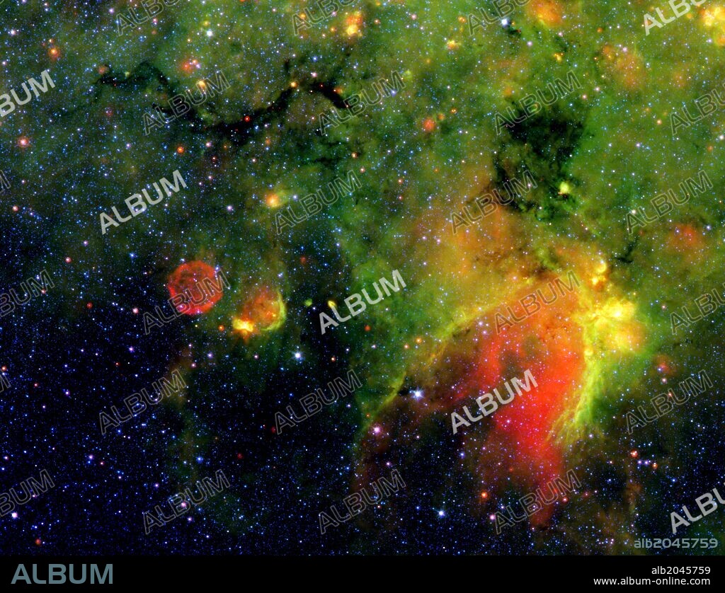 infrared image from NASA Spitzer Space Telescope shows what astronomers refer to as a 'snake' (upper left) and its surrounding stormy environment. The object is the core of a thick, sooty cloud large enough to swallow dozens of solar systems.