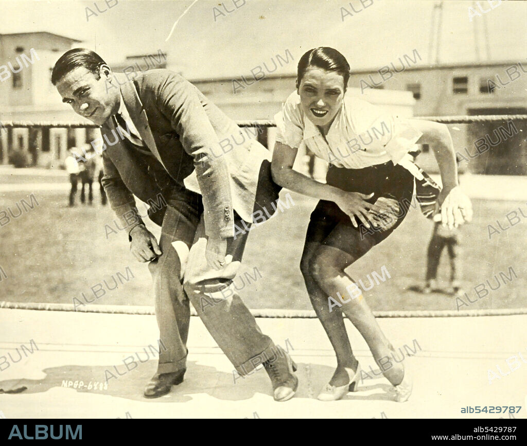 1925 -  Frank Farnum coaching Pauline Starke. And now the Charleston is moving into the movies! Pauline Starke will introduce it to the movie public at large when in the role of a chorus girl in Metro-Goldwyn-Mayer's 'A Little bit of Broadway', she performs it on the screen. Frank Farnum, originator of the step, gave her first-hand (or foot) instructions.