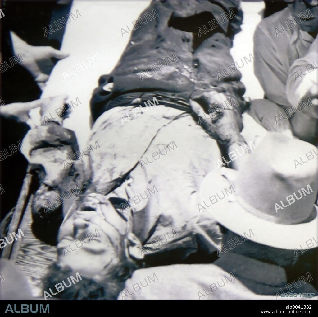 Body of Clyde Chestnut Barrow (1909 - May 23, 1934) American criminal, part of the Bonnie and Clyde couple who travelled the Central United States with their gang during the Great Depression, known for their bank robberies, although they preferred to rob small stores or rural funeral homes. Their exploits captured the attention of the American press and its readership during what is occasionally referred to as the "public enemy era" between 1931 and 1934.