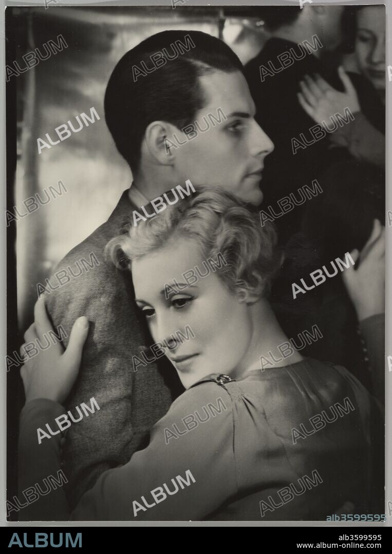 Tanzbar. Artist: Yva (Else Simon) (German, 1900-1942). Dimensions: Image: 24.3 x 17.8 cm (9 9/16 x 7 in.). Date: ca. 1930.
Yva worked as a commercial photographer in Berlin specializing in fashion and portrait photography. Here she captures the dreamy narcissism of a dancing couple, for the moment oblivious to the increasingly turbulent world outside the dance hall. Yva's own career was tragically cut short under Nazi rule. A Jew, she was forced to give up management of her studio in 1936; after 1938, no longer allowed to work as a photographer, she became an X-ray technician. She died in a concentration camp in 1942.