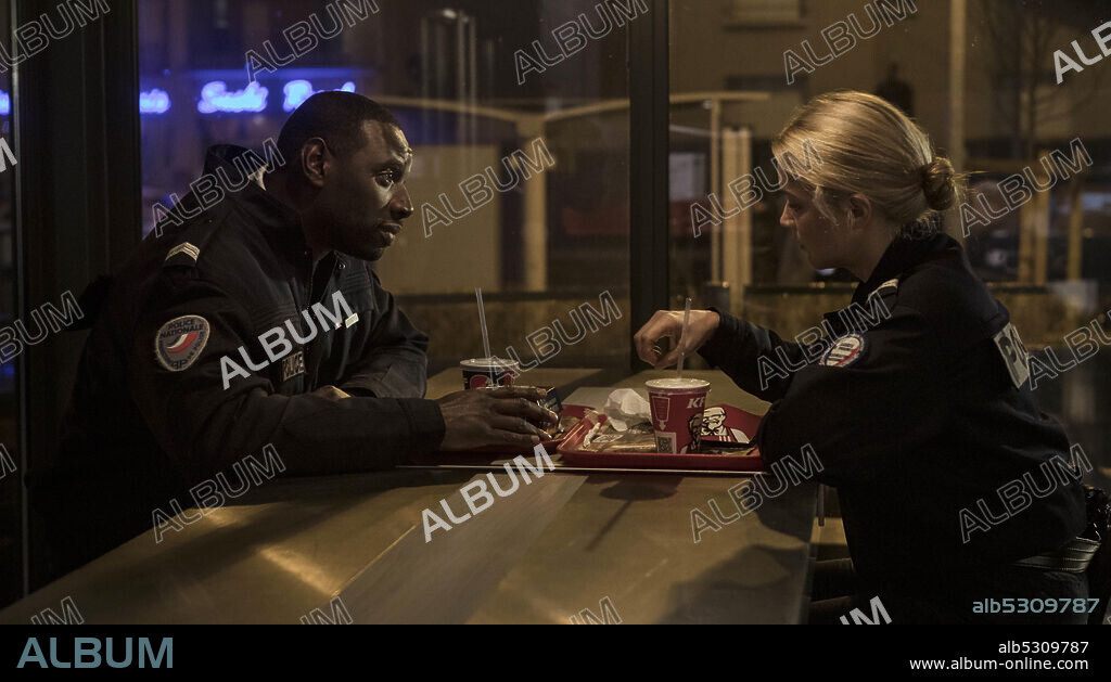 OMAR SY and VIRGINIE EFIRA in NIGHT SHIFT, 2020 (POLICE), directed by ANNE FONTAINE. Copyright Bona Film Group.