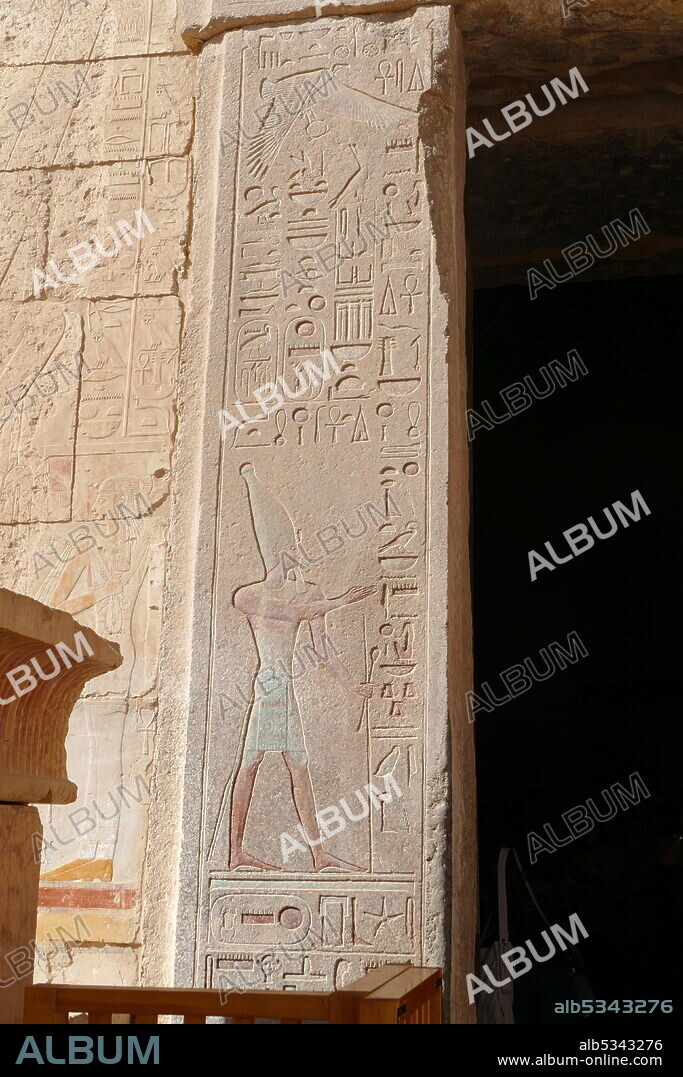 Wall relief (painted) depicting a pharaoh wearing the hedjet or White Crown for Upper Egypt. Temple of Hatshepsut, near Luxor, Egypt. The mortuary temple and tomb dates to the Eighteenth dynasty, and was designed by Senenmut, royal steward and architect of Hatshepsut. It was constructed during the 15th century BC, During the Eighteenth dynasty.