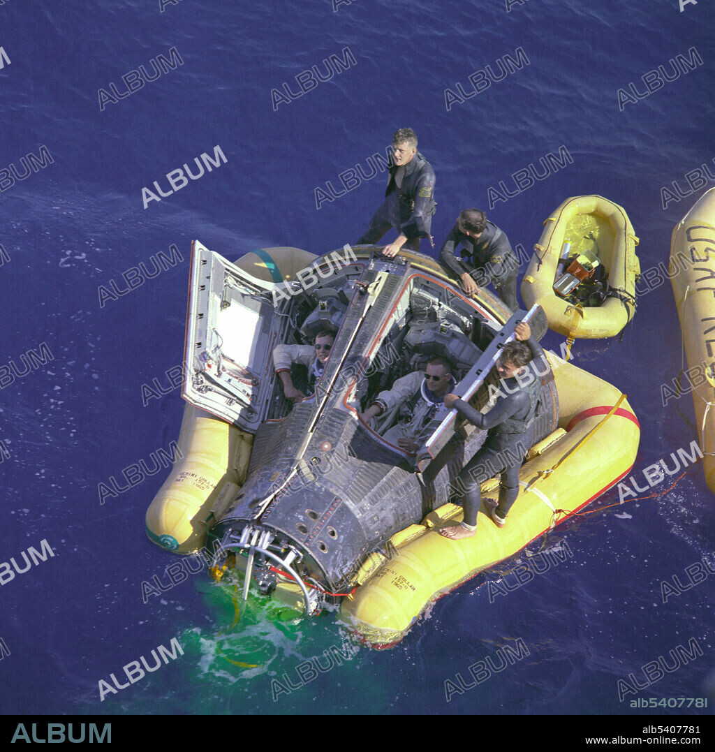 Astronauts Neil Armstrong and David R. Scott sit with their spacecraft hatches open while awaiting the arrival of the recovery ship, the USS Leonard F. Mason, after the successful completion of their Gemini 8 mission. They're assisted by rescue personnel. Gemini-Titan 8 (GT-8) spacecraft, carrying astronauts Neil A. Armstrong, command pilot, and David R. Scott, pilot, was successfully launched by NASA John F. Kennedy Space Center at 11:41 a.m. (EST), March 16, 1966. An attempt will be made to rendezvous and dock the GT-8 spacecraft with Agena Docking Target Vehicle. Gemini 8 was the sixth manned spaceflight in NASA's Gemini program. The mission conducted the first docking of two spacecraft in orbit, but suffered the first critical in-space system failure of a U.S. spacecraft which threatened the lives of the astronauts and required immediate abort of the mission. The crew was returned to Earth safely.