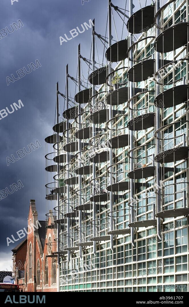 The Custard Factory, Digbeth, Birmingham. Looking south-west along the studio building towards the 19th century factory, showing the structure supporting its elliptical balconies.