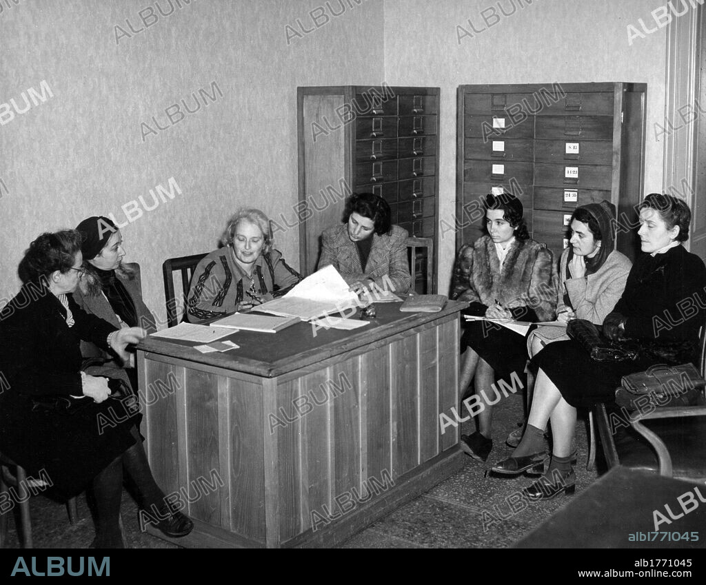 Rita Montagnana Togliatti during a meeting. The president of the Union of Italian Women Rita Montagnana Togliatti, Emilia Siracusa Cabrini and other women taking part in a meeting for the redistribution of U.S. aid. Rome, November 1944.