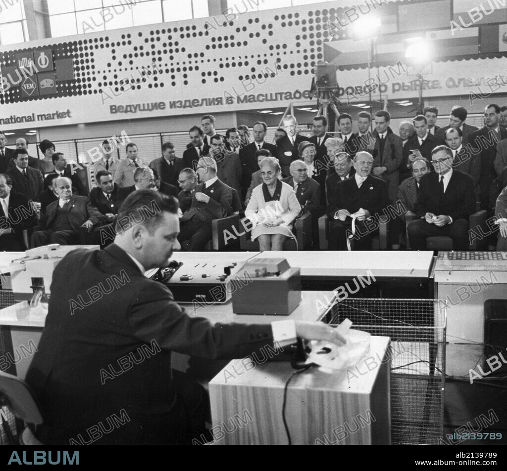 1969 leipzig spring fair, march 3, 1969, delegates of the ussr and gdr watching a demonstration of the first long-distance data transmission leipzig-moscow-leipzig (2,000km in each direction) using transmission equipment newly developed by the rafena enterprise in radeberg (gdr), a numerically controlled processing center which was directly connected via the telecommunication network with the computer center of the institute for machine tool engineering (enims) in moscow, seated in the first row (r to l) are v,a, kirillin, deputy chairman of the council of ministers and chairman of the committee of the ussr council of ministers for science and technology; walter ulbricht, first secretary of the central committee of the socialist unity party of germany (sed) and gdr state council chairman; lotte ulbricht; willi stoph, gdr prime minister; ussr ambassador to gdr, p,a, abrassimov; friedrich ebert, sed cc politbureau member; and rudi georgi, minister for verarbeitungsmaschinen und fahrzeugbau of the gdr. 01/02/2013