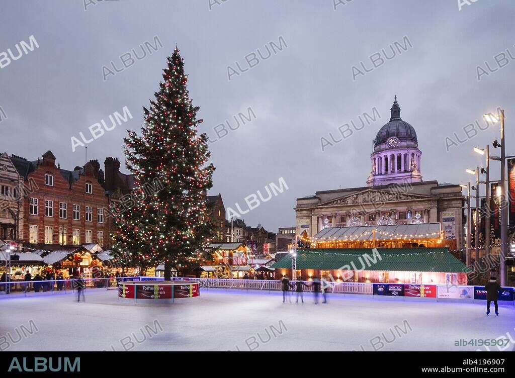 Old Market Square, Nottingham, Nottinghamshire, 2017. General view of Old Market Square from the south-west during a 'Winter Wonderland' event, with an illuminated Christmas tree on a temporary ice rink in the foreground, and the Council House behind.