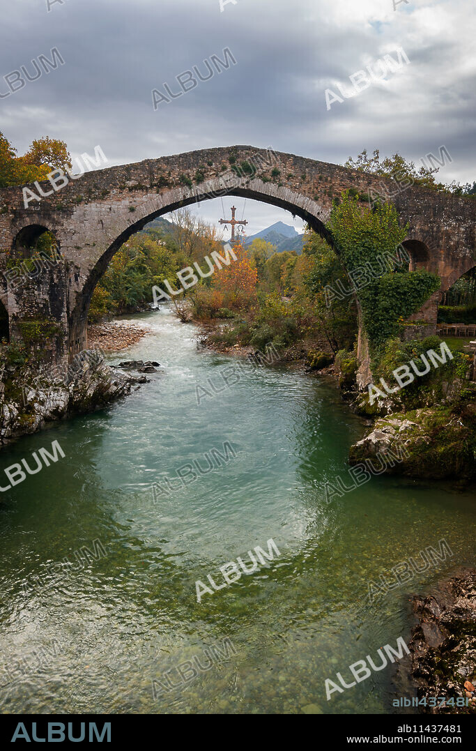 Cangas de Onis historic medieval Roman bridge over the Sella River in Picos de Europa National Park, Asturias, Spain, Europe.