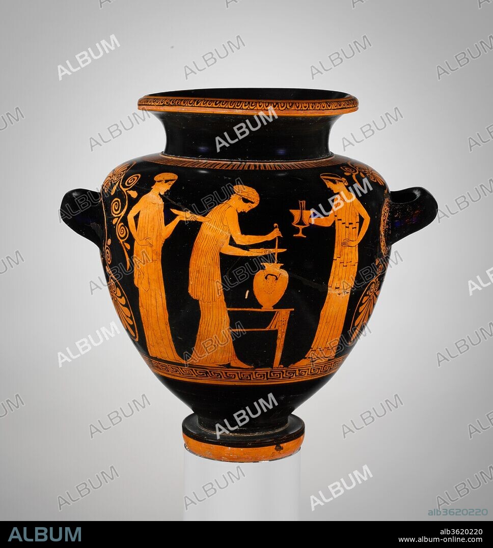 Terracotta stamnos (jar). Culture: Greek, Attic. Dimensions: H. 12 1/4 in. (31.1 cm). Date: ca. 450-440 B.C..
Obverse, woman ladles wine from a stamnos into a phiale (libation bowl) while companions hold phiale and kantharos
Reverse, three women holding thyrsoi
The women preparing wine and holding thyrsoi, the wands associated with maenads, suggest that this scene relates to a festival of Dionysos Lenaios, celebrated in Athens toward the end of January.  The original Dionysos Lenaios was a column with a bearded mask.  A number of Athenian vases show this idol surrounded by women ladling wine.