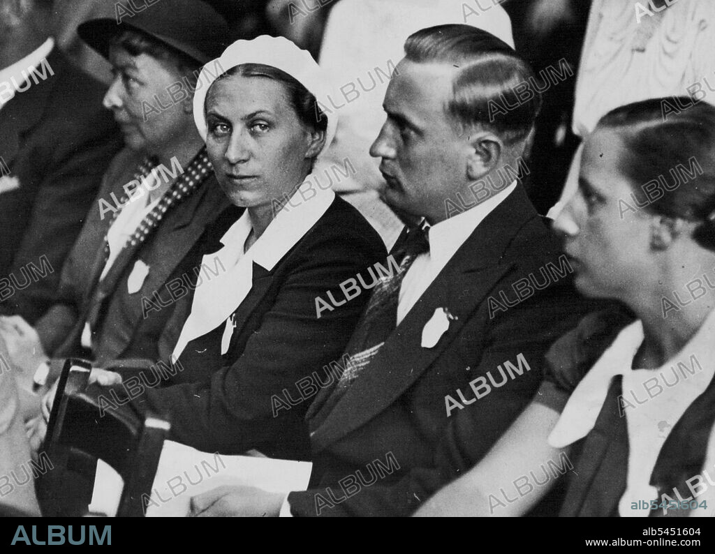 Frau Gertrud Scholtz Klink (wearing white beret) was described by Hitler as the "perfect woman." She is leader of women's organizations in Germany. The photograph was taken in London when she attended a conference on social work. July 28, 1936. (Photo by Sport & General Press Agency, Limited).