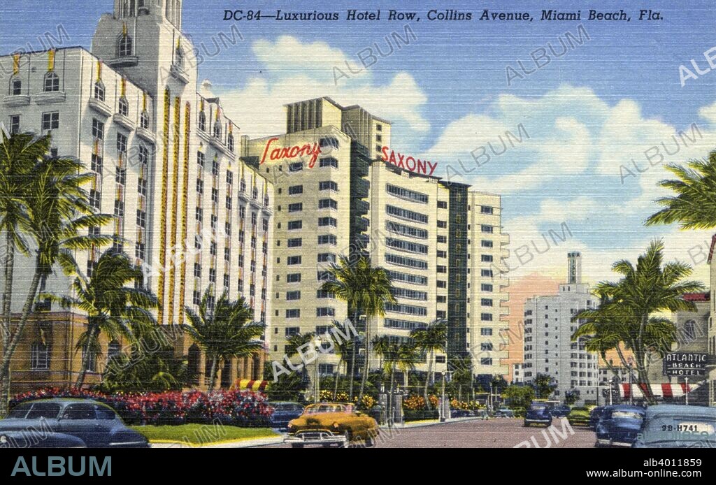 Hotel Row, Collins Avenue, Miami Beach, Florida, USA, 1949. Vintage linen postcard showing the luxurious Art Deco hotels on Collins Avenue. The landscape along the sidewalks is tropical and cars are driving along the street. The Saxony Hotel is in the centre of the image.