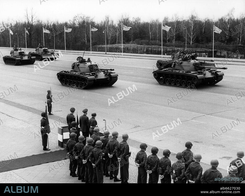 American tanks driving past a VIP stand during a parade to the farewell of General Bruce C. Clarke on 6th April 1962 in Berlin. General Clarke, supreme commander of the US Army in Europe, retires after a 42 years term of service. 06/04/1962