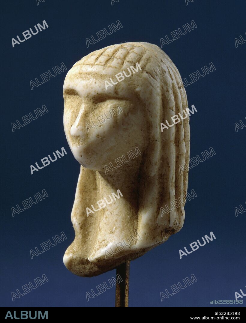 Venus of Brassempouy, fragment of a statue made from mammoth ivory, 3.65 x2.2x1.9 cm, from the Grottes du Pape, Brassempouy, Aquitaine, France. Upper Paleolithic period, ca 25,000 BC.