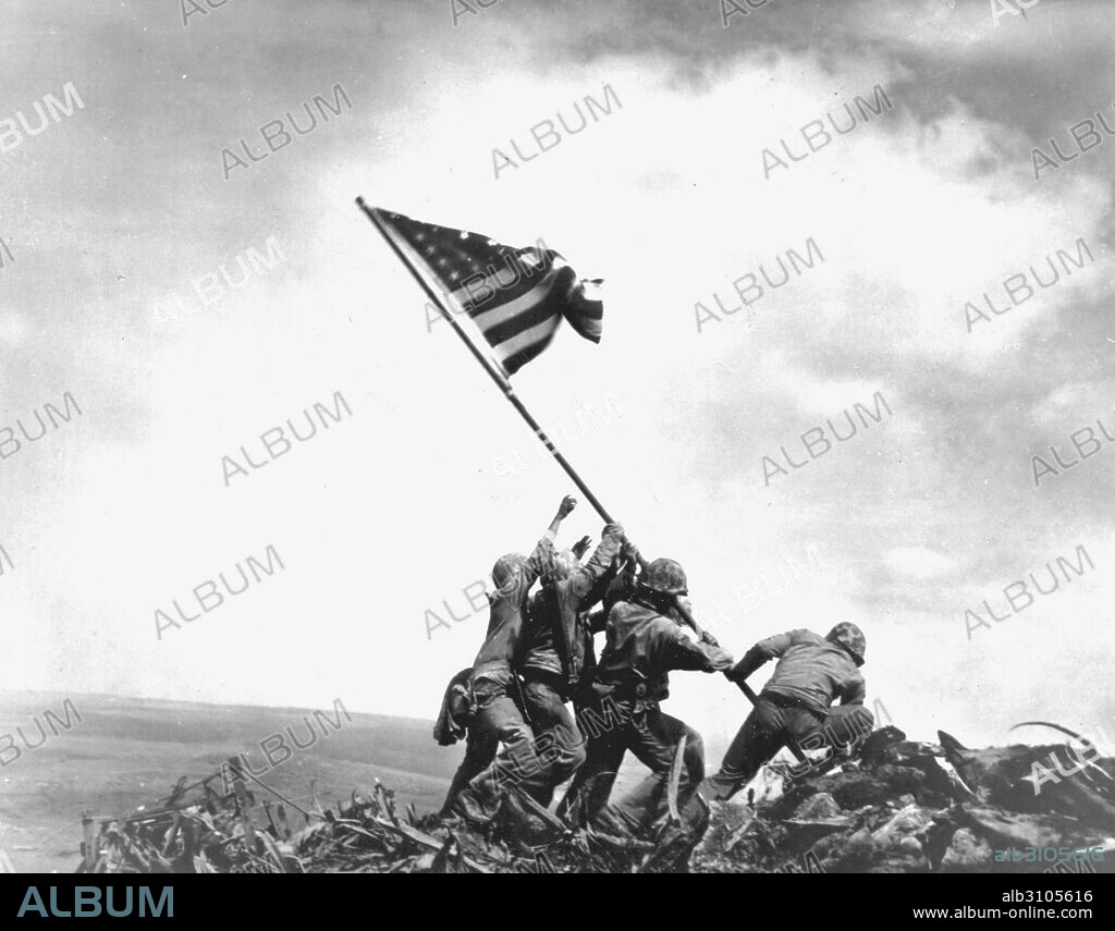 Flag raising on Iwo Jima. Left to right: Pvt 1st class Ira H. Hayes, Pvt 1st class Franklin Sousley, (KIA),  Sergeant Michael Stank, (KIA), Pharmacist Mate 2/c John H Bradley, Pvt 1st class Rene A. Gagnon and Corporal Harlon H Block, (KIA).