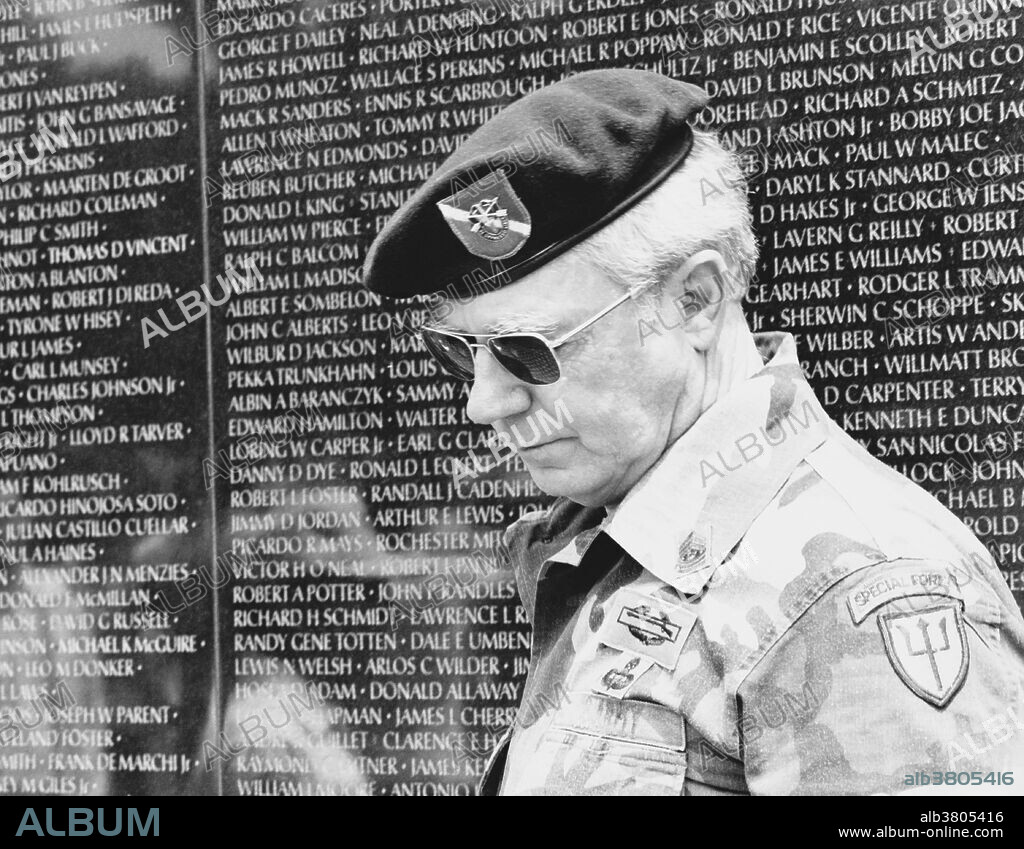 A veteran at the Vietnam Veterans Memorial, Washington, DC., 1988.  The wall of the Vietnam Veterans Memorial contains the names of every deceased or missing soldier who served in the Vietnam War. It was designed by Maya Lin, a 21-year-old Yale architecture student, and is located on the National Mall in Washington, D.C.