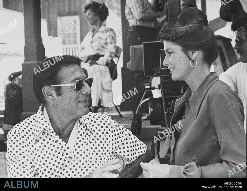IRWIN ALLEN and KATHERINE ROSS in THE SWARM, 1978, directed by IRWIN ALLEN. Copyright WARNER BROTHERS.