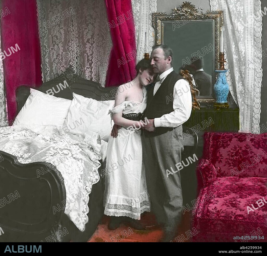 Erotic, series, man and woman hug in the bedroom, woman in petticoat, 1910s, Germany, Europe.