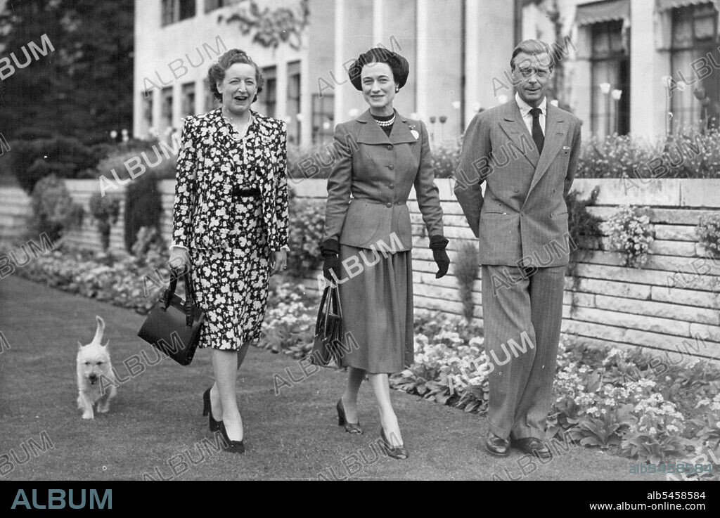 The Windsor HerPicture Shows: The Duke and Duchess of Windsor pictured with Mrs Frank Parkinson (Left), walking the grounds of Charters this afternoon, Friday. The Duke and Duchess of Windsor where passengers in the "Queen Elizabeth", docking at Southampton form New York last night. They left the ship this morning (Friday) and motored to Charters, the luxury house at Sunninghilll, Berks, loaned to them by Mrs. Frank Parkinson. After a fortnight in this Country. the Duke and Duchess will leave to spend the summer in the South of France. May 16, 1947. (Photo by Reuterphoto).
