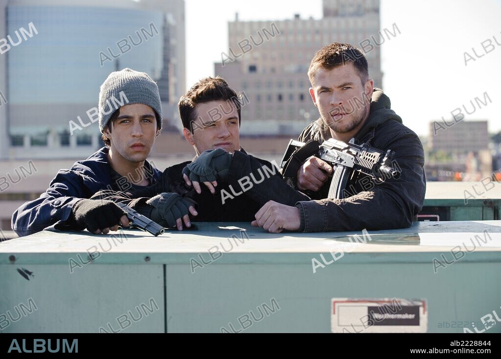 CHRIS HEMSWORTH, JOSH HUTCHERSON and JOSH PECK in RED DAWN, 2012, directed by DAN BRADLEY. Copyright FILMDISTRICT.