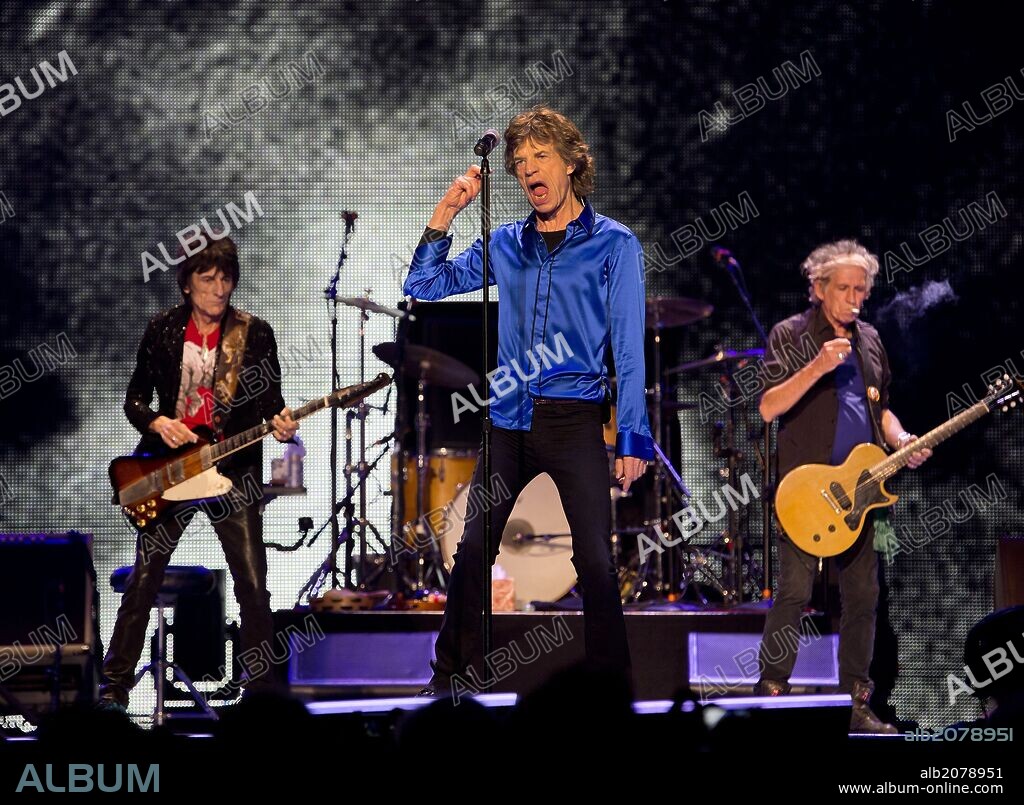 May 5, 2013 - Oakland, California, U.S. - Lead singer of the Rolling Stones MICK JAGGER sings, center, performs with Ronnie Wood, left, as Keith Richards, left, smokes a cigarette , during the ''50 & Counting Tour'' to celebrate the 50th anniversary of the band. The 2012-2013 tour started on November 25, 2012 and ends July 13, 2013, with 7 shows in Europe and 22 in North America. The Stones performed at Oakland's Oracle Arena on Sunday. 05/05/2013