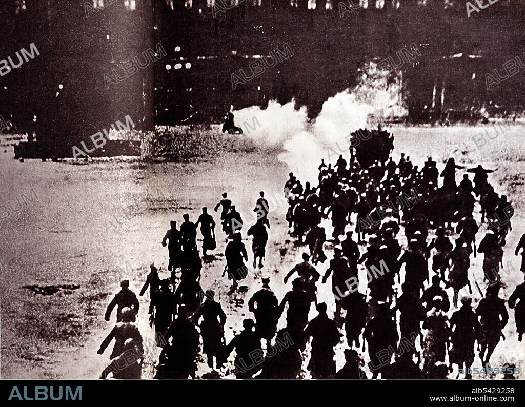 The October Revolution takes place in Russia. Workers, peasants and soldiers on way to storm the Tsar's Winter Palace in Petrograd.