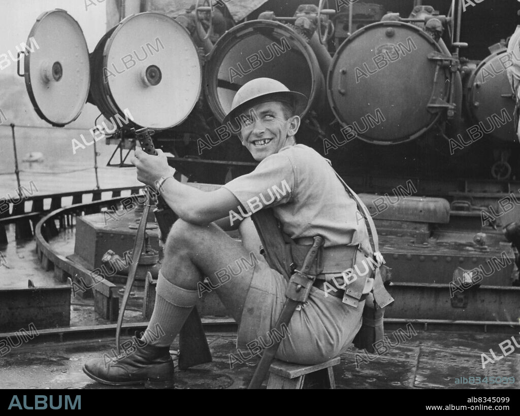 Looking rather ridiculous is Able Seaman Ted May of Drummoyne N.S.W. sitting on a midget stool found in H.M.S. Thracian a British destroyer which was captured by the Japanese in Singapore and surrendered in the Yokosuka Naval base. September 24, 1945. (Photo by Australian Official Photo).
