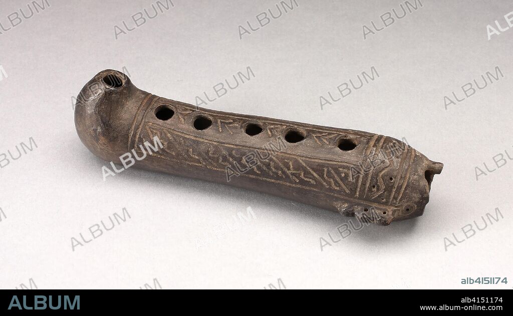 CHIMU. Flute Incised with Geometric Design. Chimú; North coast, Peru. Date: 1200-1450. Dimensions: 18.4 x 5.1 cm (7 1/4 x 2 in.). Ceramic. Origin: North Coast.