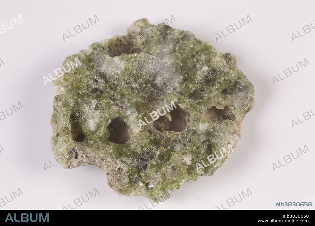 Trinitite, also known as atomsite or Alamogordo glass, is the glassy residue left on the desert floor after the plutonium-based Trinity nuclear bomb test on July 16, 1945, near Alamogordo, New Mexico. The glass is primarily composed of arkosic sand composed of quartz grains and feldspar that was melted by the atomic blast. Trinitite is mildly radioactive but is safe to handle for short periods of time.