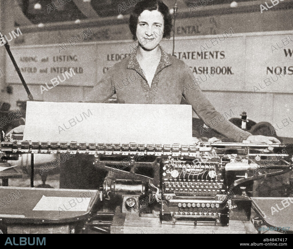 The world's largest typewriter on display at the Business Efficiency Exhibition, White City, London, England in 1931. From The Pageant of the Century, published 1934.