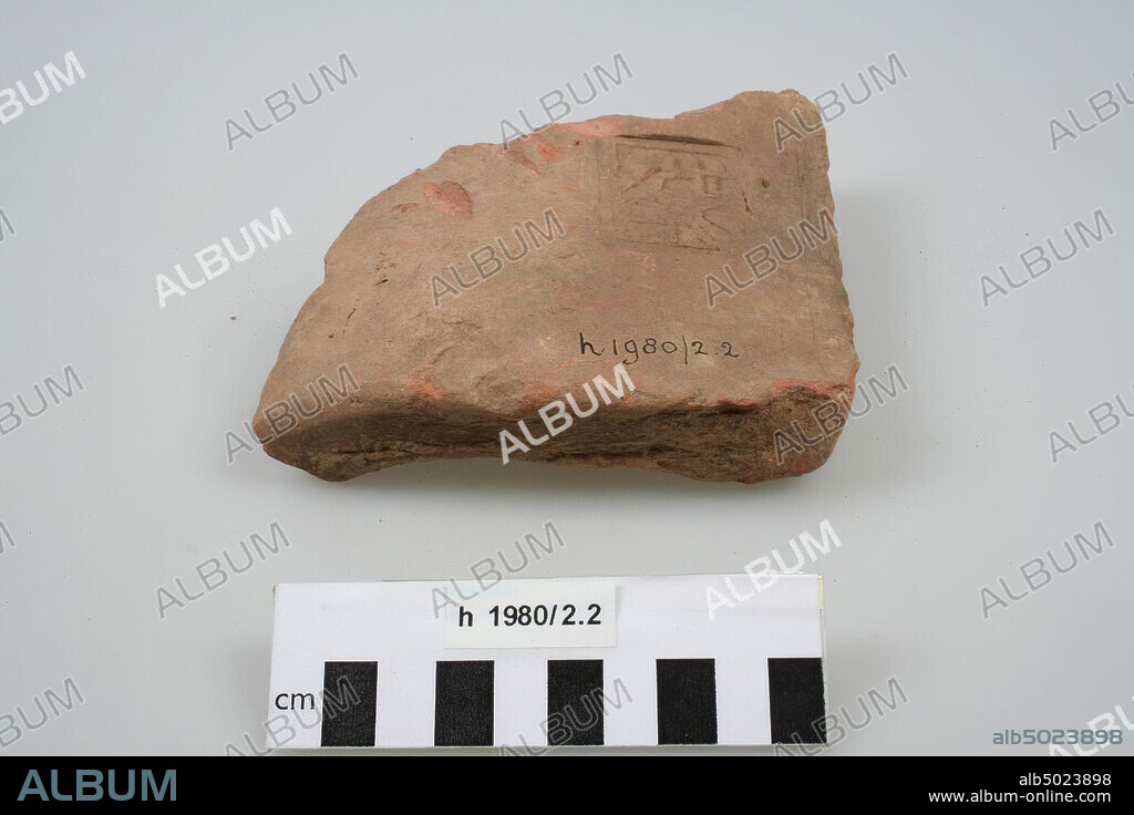 Fragment of an imbrex of brick with stamp EXGERINF. Chips from the surface, roof tile (imbrex), fragment, earthenware, brick, 12.8 x 11.9 x 4 cm, roman, Netherlands, South Holland, Katwijk, Valkenburg.
