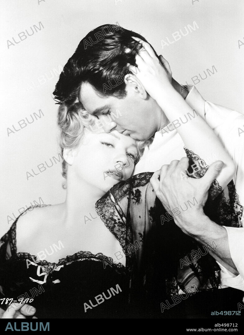 ANNE BAXTER and ROCK HUDSON in ONE DESIRE, 1955, directed by JERRY HOPPER. Copyright UNIVERSAL PICTURES.